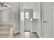 Bright hallway with wood-look floors and window leading to rooms at 1402 Harbour Walk Rd, Tampa, FL 33602