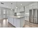 Bright, spacious kitchen with stainless steel appliances, large island, and light wood flooring at 1402 Harbour Walk Rd, Tampa, FL 33602