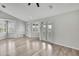 Living room with hardwood floors, plantation shutters, and french doors at 1402 Harbour Walk Rd, Tampa, FL 33602