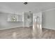 Open-concept living room with hardwood floors and modern lighting fixture at 1402 Harbour Walk Rd, Tampa, FL 33602