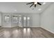 Spacious living room with hardwood floors, french doors, and plantation shutters at 1402 Harbour Walk Rd, Tampa, FL 33602