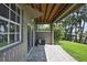 Covered patio with stone flooring, exposed wood ceiling, and view of the waterfront at 1402 Harbour Walk Rd, Tampa, FL 33602