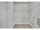 Walk-in closet with wire shelving and hardwood floors at 1402 Harbour Walk Rd, Tampa, FL 33602