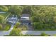 Charming home featuring a pool and lush landscaping in a private, wooded setting at 15025 Shark St, Hudson, FL 34667