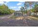 Expansive backyard with screened pool offering a private outdoor oasis at 15025 Shark St, Hudson, FL 34667