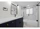 Renovated bathroom features a walk-in shower and a stylish vanity at 15025 Shark St, Hudson, FL 34667
