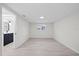 Bright bedroom with wood-look flooring and a single window at 15025 Shark St, Hudson, FL 34667