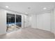 Bedroom area with sliding glass door access to the pool and a closet at 15025 Shark St, Hudson, FL 34667