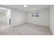 Neutral bedroom with wood-look flooring, and a single window at 15025 Shark St, Hudson, FL 34667