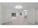 Open living space with access to the outdoor patio and kitchen area at 15025 Shark St, Hudson, FL 34667