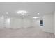 Spacious living room area showcasing light-colored floors at 15025 Shark St, Hudson, FL 34667