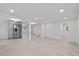 Expansive living area featuring light-colored floors, a kitchen, and ample space at 15025 Shark St, Hudson, FL 34667