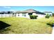 Well-maintained backyard with lush green grass and privacy fence, perfect for outdoor activities at 15709 Demory Point Pl, Ruskin, FL 33573