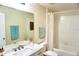 Bathroom with a tub/shower combination, marble vanity and modern fixtures at 15709 Demory Point Pl, Ruskin, FL 33573