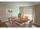 Dining room with a decorative light fixture and large sliding glass door at 15709 Demory Point Pl, Ruskin, FL 33573