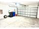 Spacious two-car garage with ample storage space, ready for parking and projects at 15709 Demory Point Pl, Ruskin, FL 33573
