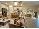 Inviting living area featuring an open layout, tile floors, and bright, white kitchen with stainless appliances at 15709 Demory Point Pl, Ruskin, FL 33573