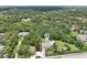 Expansive aerial view of a private residence nestled among lush greenery and mature trees at 1709 Main St, Safety Harbor, FL 34695