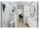 Stylish bathroom leading into bedroom area featuring modern fixtures, vanity and toilet at 1709 Main St, Safety Harbor, FL 34695