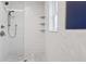 Modern bathroom featuring a tiled shower, sleek fixtures, and decorative tile accents at 1709 Main St, Safety Harbor, FL 34695