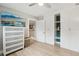 Bedroom featuring modern drawers, wood floors, and closet at 1709 Main St, Safety Harbor, FL 34695