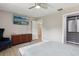 Bedroom featuring a TV, modern furniture and a walk in closet at 1709 Main St, Safety Harbor, FL 34695