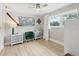 Bedroom with wood floors, natural light, and map wall decor at 1709 Main St, Safety Harbor, FL 34695