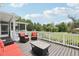 Deck featuring outdoor seating perfect for enjoying views of the lush backyard at 1709 Main St, Safety Harbor, FL 34695