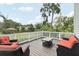 Outdoor deck with comfortable seating, providing a relaxing space to enjoy the surrounding landscape at 1709 Main St, Safety Harbor, FL 34695