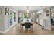 Large dining room with modern chandelier, access to the outside, and a built-in buffet at 1709 Main St, Safety Harbor, FL 34695