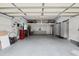 Organized garage with built-in cabinets, storage, and ample space for vehicles and projects at 1709 Main St, Safety Harbor, FL 34695