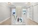 A home hallway with two bedroom entrances and contemporary lighting at 1709 Main St, Safety Harbor, FL 34695