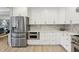 Modern kitchen with stainless steel appliances, ample cabinet space, and marble countertops at 1709 Main St, Safety Harbor, FL 34695