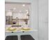 Modern kitchen area with stainless steel appliances, marble countertops and breakfast bar at 1709 Main St, Safety Harbor, FL 34695
