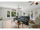 Comfortable living room with large windows, ceiling fans, and a view to the outside at 1709 Main St, Safety Harbor, FL 34695