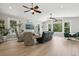 Open-concept living room with vaulted ceilings, large windows, and comfortable seating options for gatherings at 1709 Main St, Safety Harbor, FL 34695