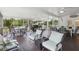 Spacious screened-in patio featuring comfortable seating, outdoor dining, and cooking area at 1709 Main St, Safety Harbor, FL 34695