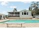 Beautiful backyard featuring a pool, shed, patio and inviting outdoor living space at 1709 Main St, Safety Harbor, FL 34695