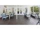 Inviting outdoor porch featuring comfortable seating, ceiling fan, and open view at 1709 Main St, Safety Harbor, FL 34695