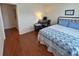 Cozy bedroom featuring a desk area and wood flooring at 18531 Bent Pine Dr, Hudson, FL 34667