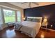 Comfortable bedroom featuring a large window providing natural light at 18531 Bent Pine Dr, Hudson, FL 34667