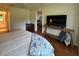 Well-lit bedroom with modern furnishings and a glimpse into the dining area at 18531 Bent Pine Dr, Hudson, FL 34667