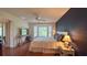 Bright bedroom with wood floors, a ceiling fan, and a picturesque window view at 18531 Bent Pine Dr, Hudson, FL 34667