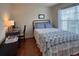 Comfortable bedroom with a desk and a window for natural light at 18531 Bent Pine Dr, Hudson, FL 34667