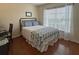 Inviting bedroom with a desk area and natural light from a large window at 18531 Bent Pine Dr, Hudson, FL 34667