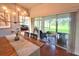 Elegant dining room with a large table, chandelier, and sliding glass doors to the outdoor patio at 18531 Bent Pine Dr, Hudson, FL 34667
