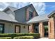 Beautifully landscaped building exterior with brick columns and a well-maintained garden at 18531 Bent Pine Dr, Hudson, FL 34667