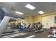 Well-equipped gym featuring treadmills, bikes, free weights, and machines for a complete workout at 18531 Bent Pine Dr, Hudson, FL 34667