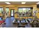 Community gym featuring treadmills, elliptical machines, and free weights for exercise and fitness at 18531 Bent Pine Dr, Hudson, FL 34667