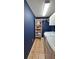 Well-organized laundry room with shelving and plenty of storage space at 18531 Bent Pine Dr, Hudson, FL 34667